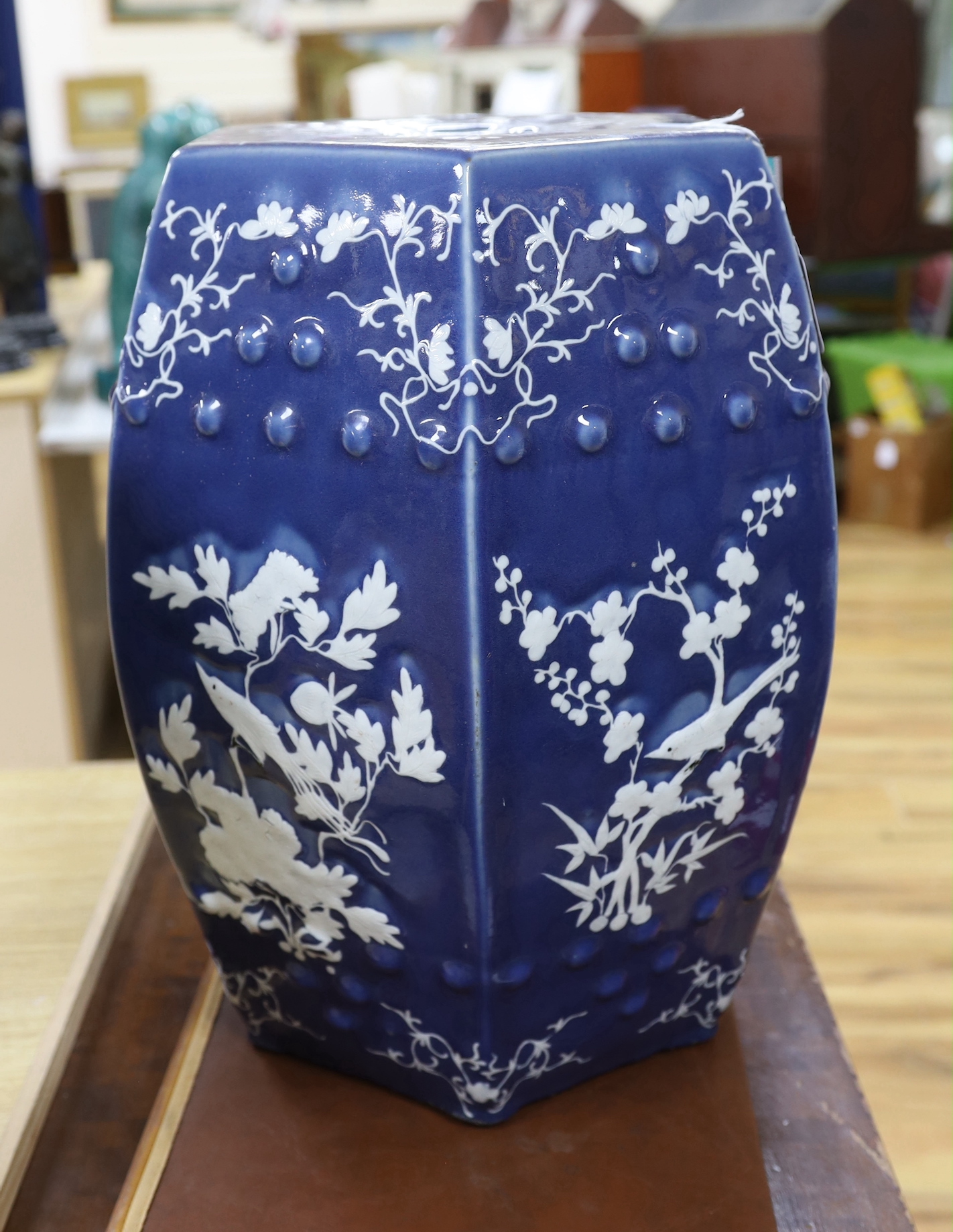 A 19th century Chinese white slip decorated powder blue garden seat, with provenance / paperwork dated to 1937, 48cm high